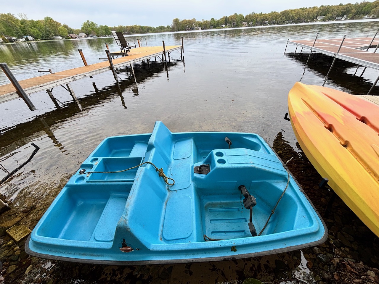 Paddle boat and kayaks at the dock